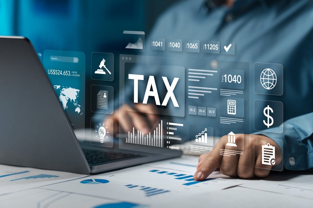 Understanding the UK Tax System: A Guide for Newcomers businessman,accounting,,calculating,income expenses,and,analyzing,investment,data,reports.,annual